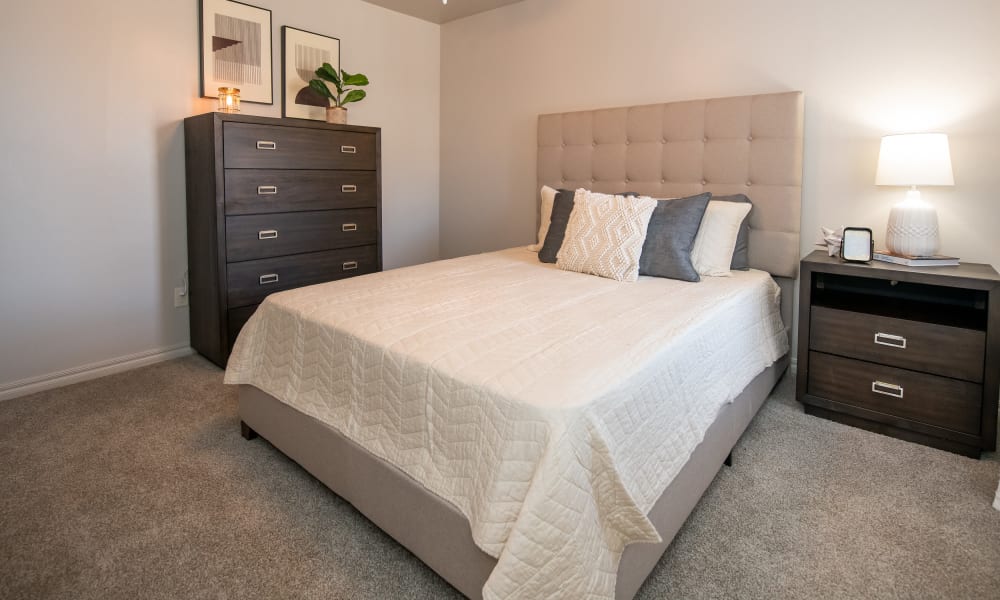 Cozy master bedroom with ceiling fan at Cross Timber in Oklahoma City, Oklahoma