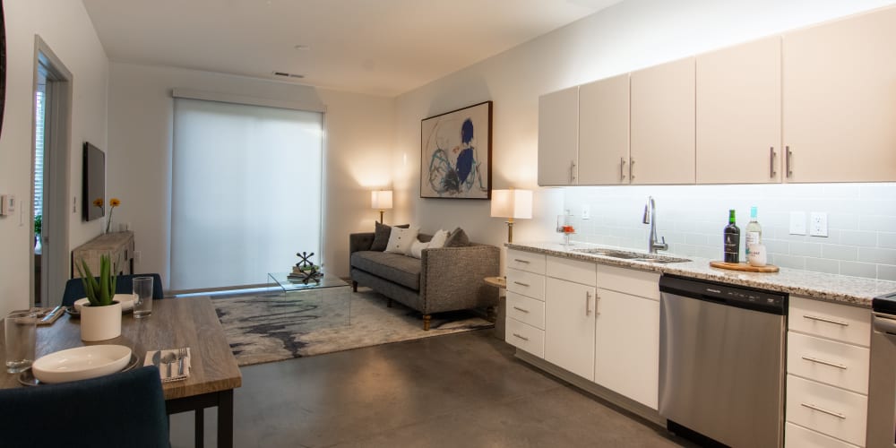 An open concept kitchen and living room in a model apartment at Innslake Place in Glen Allen, Virginia