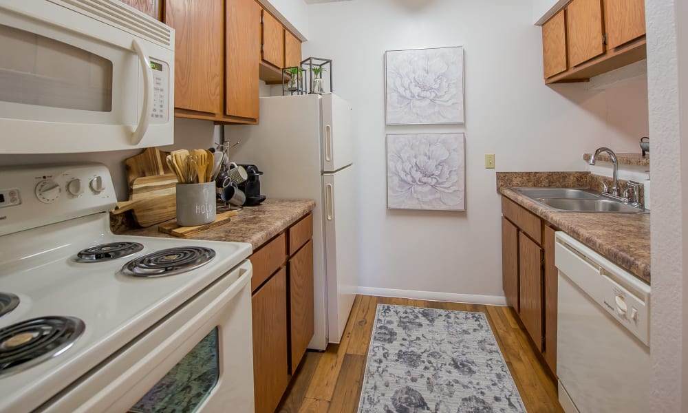 Bright and fully equipped kitchen at Windsail Apartments in Tulsa, Oklahoma