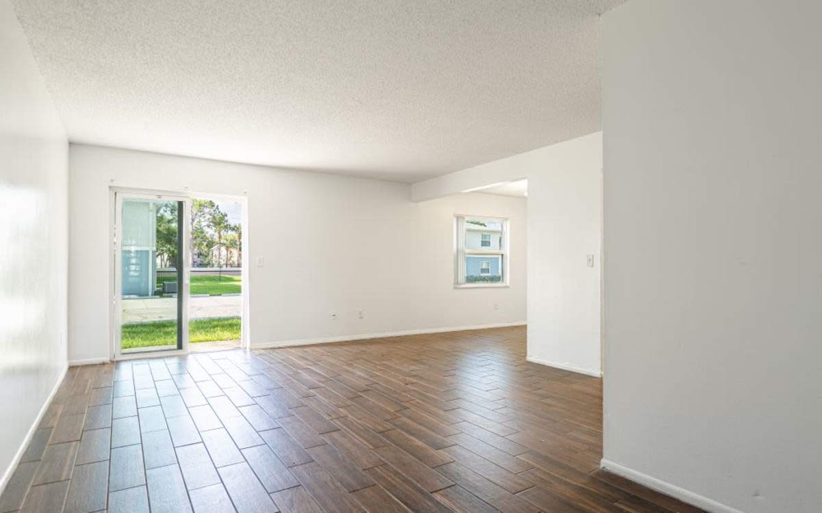 Living room with wood flooring at Dunwoodie Place in Orlando, Florida