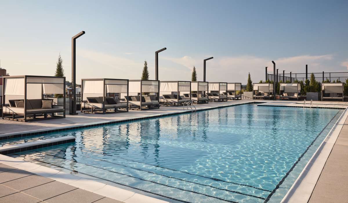 Cabanas by the resort-style pool at The Novus Apartments in Durham, North Carolina