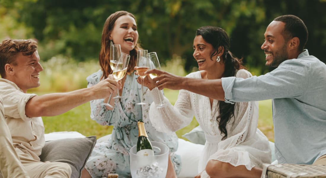 Friends enjoying a picnic in Miami Lakes, Florida near Graham Residential