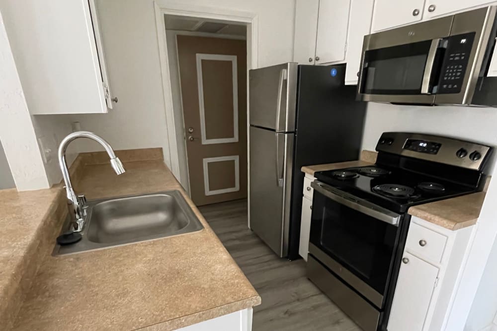 Rendering well setup kitchen Palm Lake Apartment Homes in Concord, California
