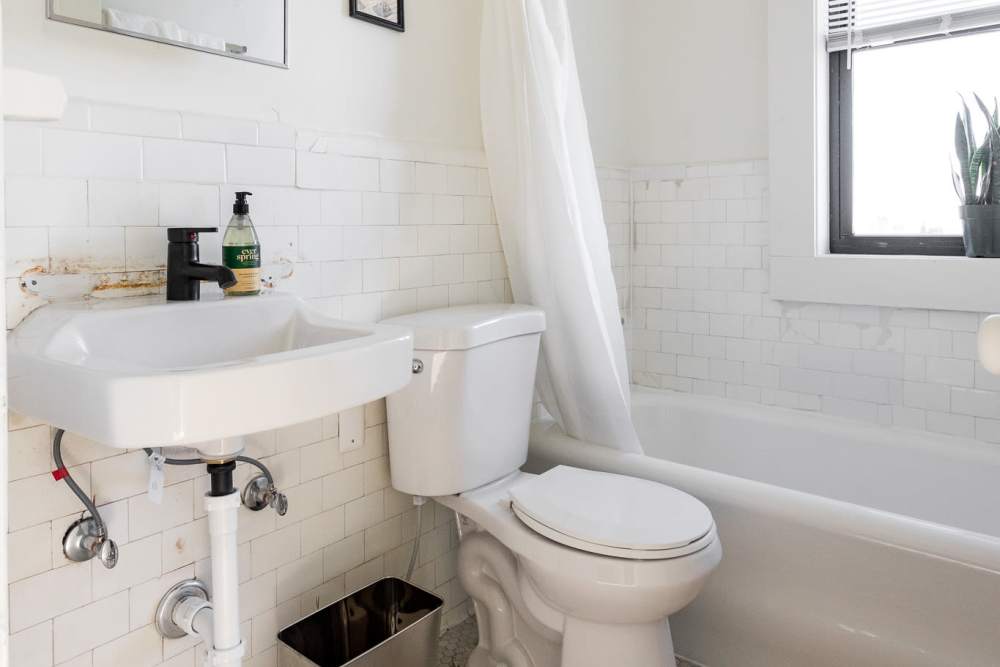 Bathroom with bathtub at Detroit Living in Detroit, Michigan