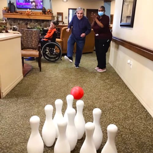 Residents bowling at Oxford Glen Memory Care at Grand Prairie in Grand Prairie, Texas