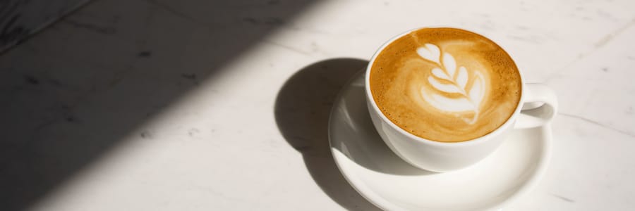 Cup of coffee sitting on a coffee table at a WISH community