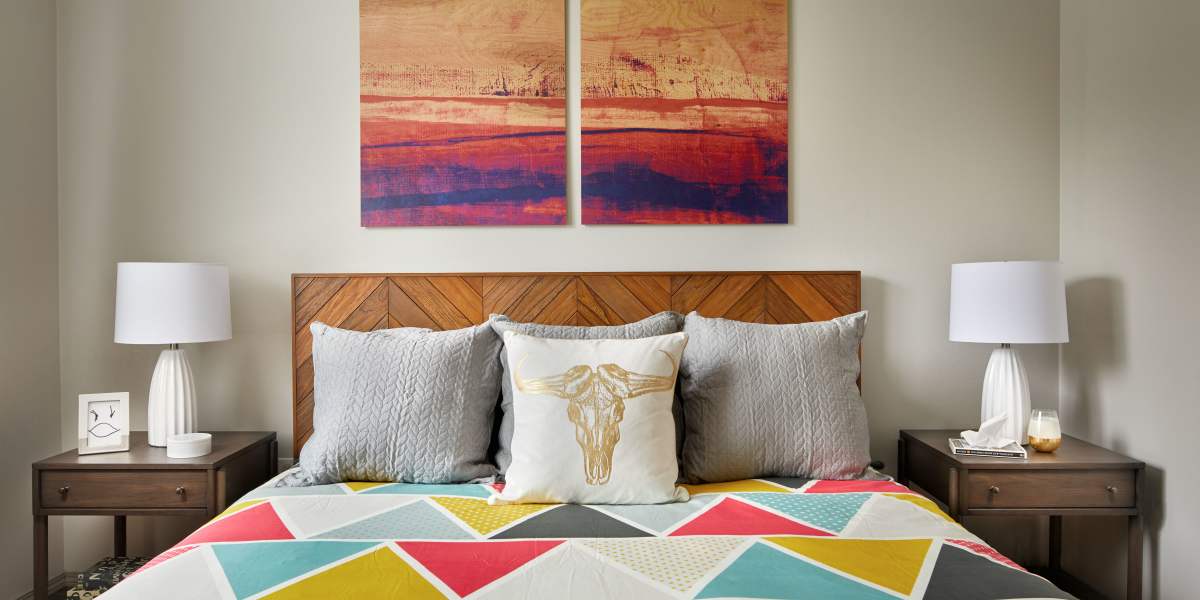 Bedroom with wall-art at Brookside Village in Auburn, Washington