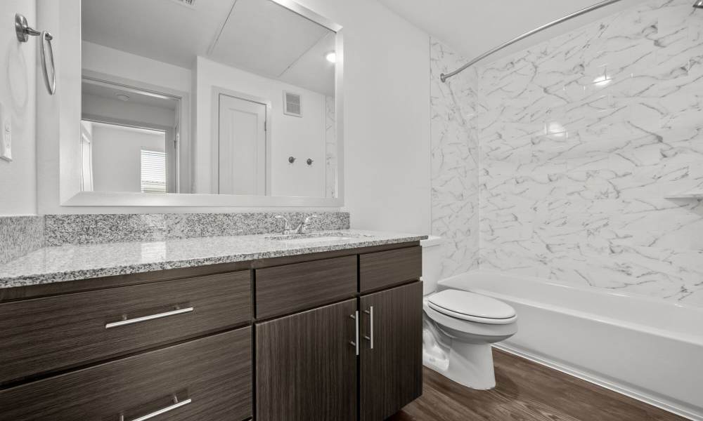 Bathroom with large mirror at Brook Hollow in Wichita Falls, Texas