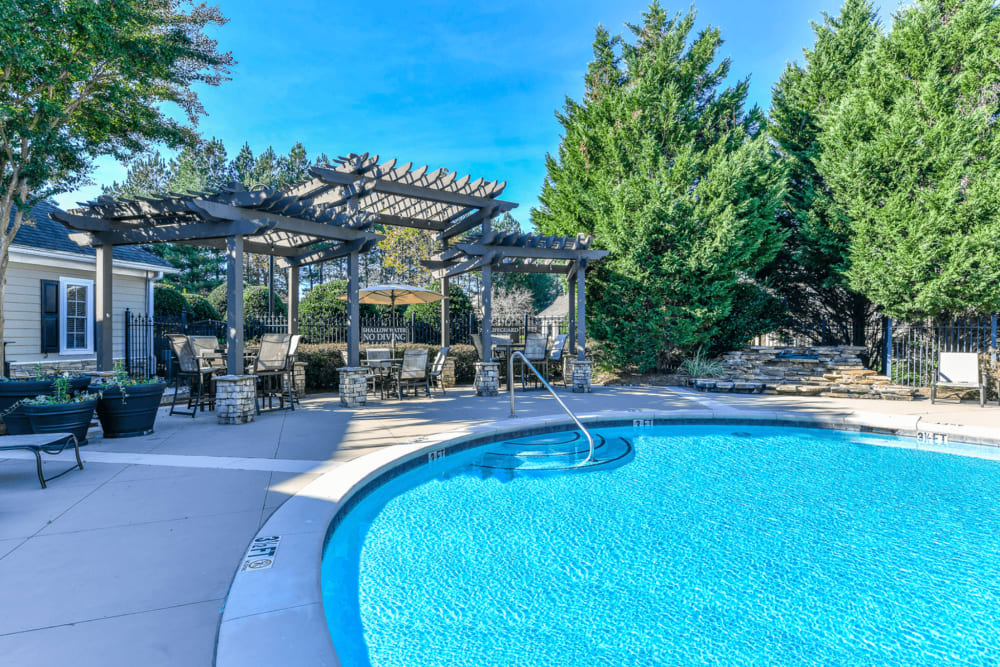 Swimming pool with seating space at Walden Creek in Greenville, South Carolina