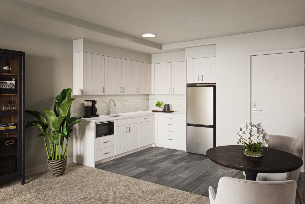 An updated kitchen with hardwood flooring at Holden of Bellevue in Bellevue, Washington