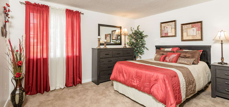 Well decorated bedroom at Maplewood Estates Apartments home in Hamburg, New York