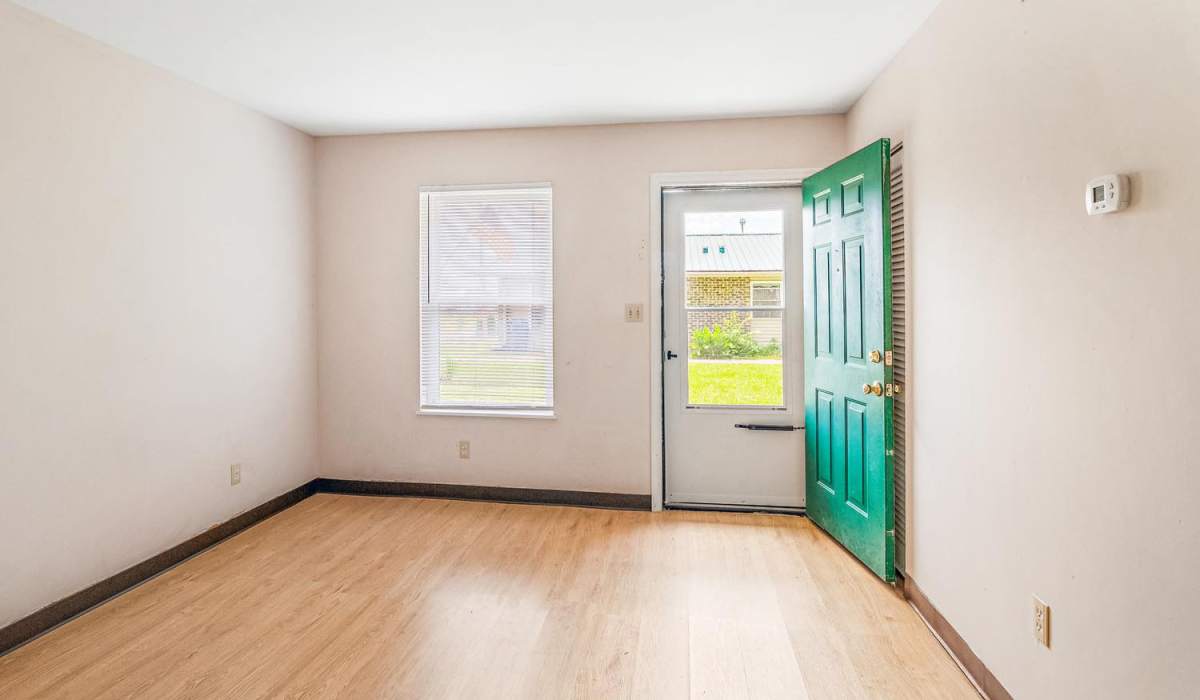 Unfurnished room with wood flooring at Walnut Street Apartments in Dickson, Tennessee