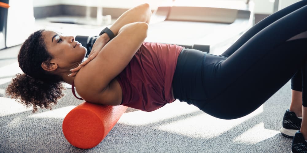 Doing sit ups in the fitness center at 24Hundred Apartments in Oklahoma City, Oklahoma