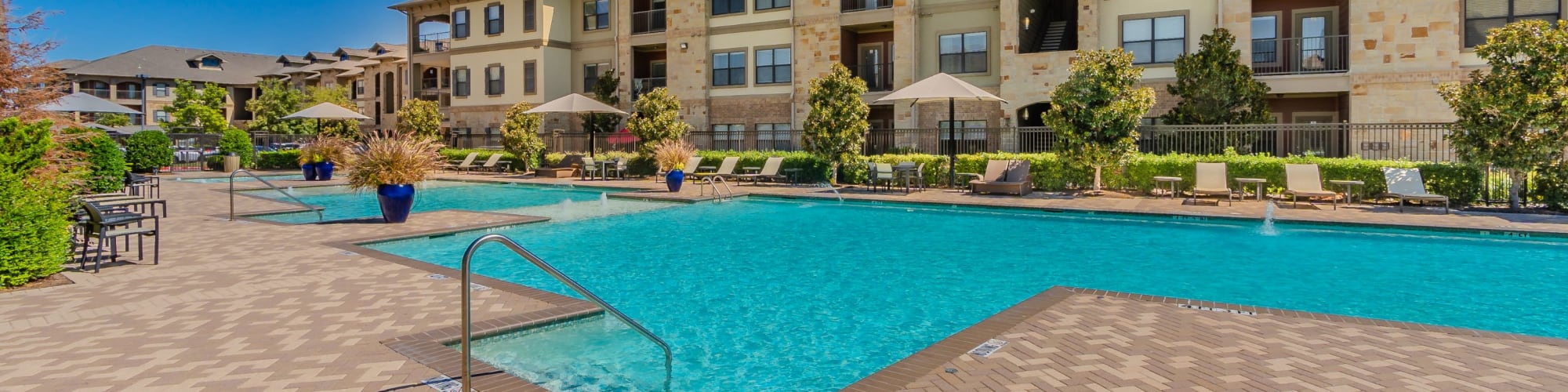 Exterior building with pool at Sorrel Phillips Creek Ranch in Frisco, Texas