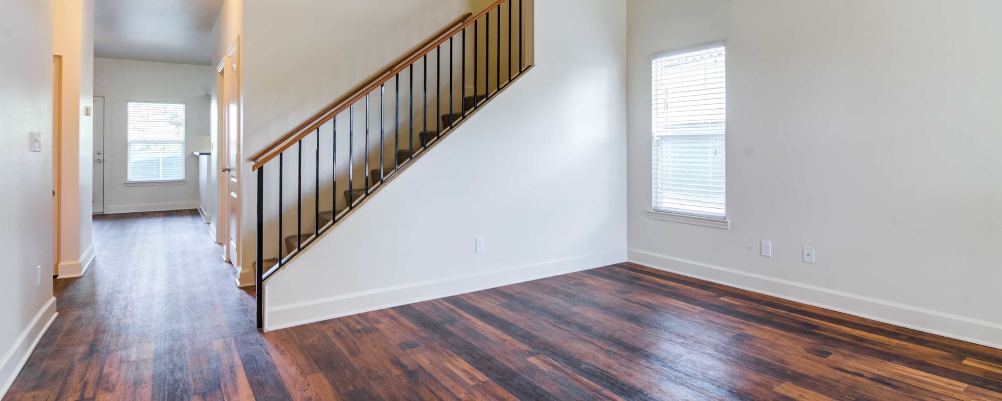 A living room with wood floors in a home at San Luis Rey in Oceanside, California