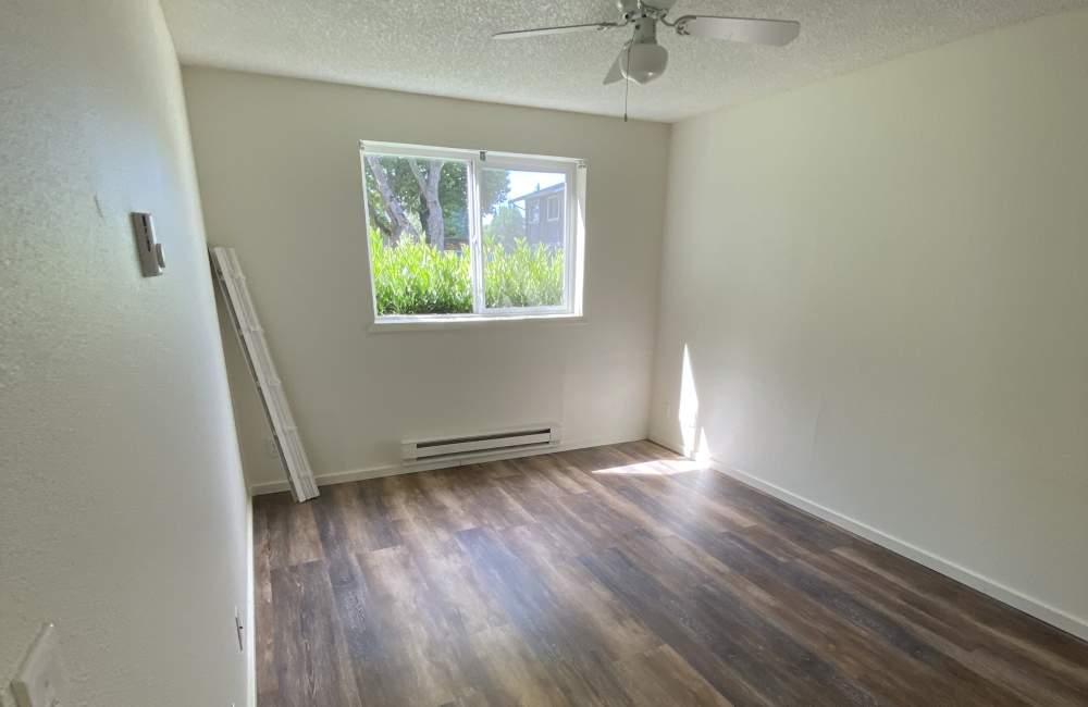 Bedroom with ceiling fan at Parkside Apartments