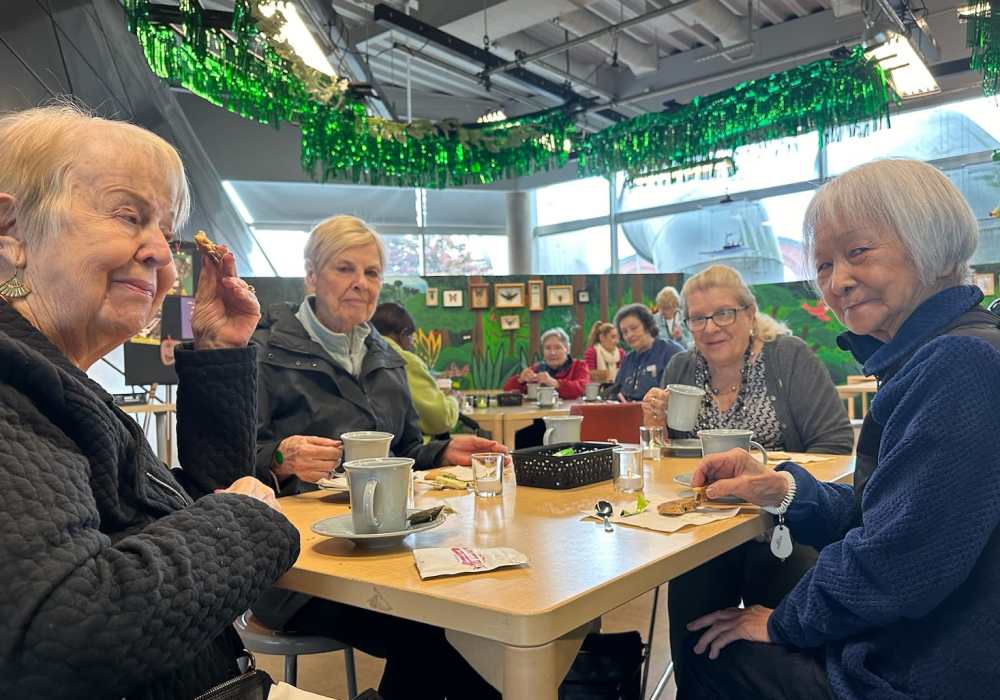 Residents enjoying coffee together at Merrill Gardens at Tukwila in Tukwila, Washington