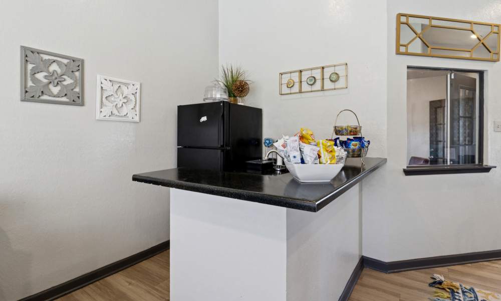 Black appliances in the community kitchen at Arbors of Taylor in Taylor, Texas