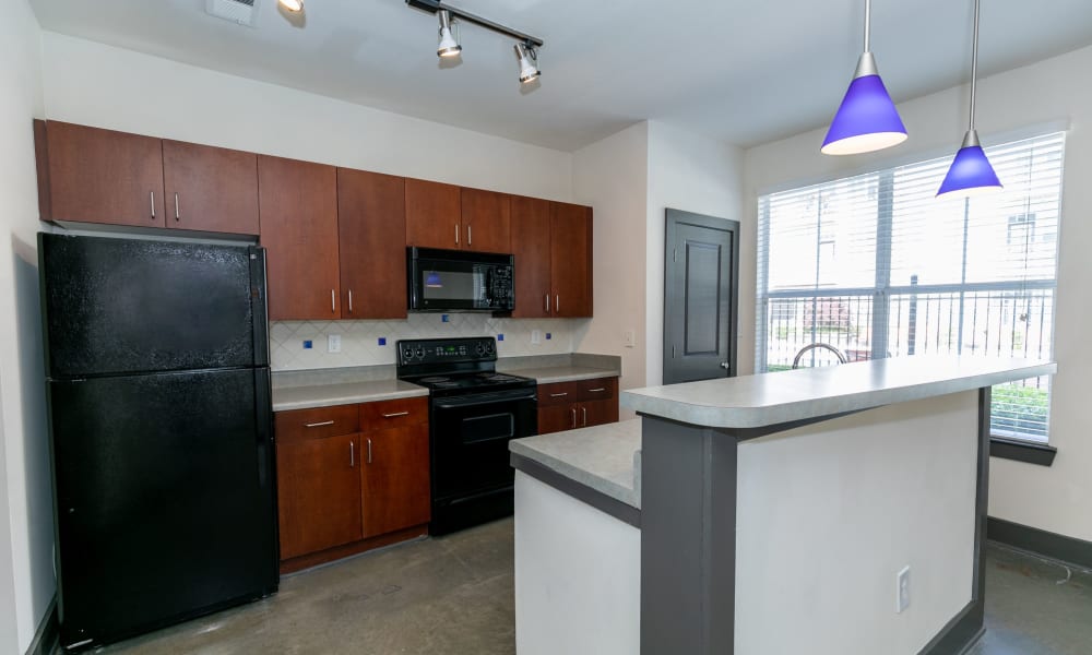 Kitchen with island inside unit at Block Lofts in Atlanta, GA