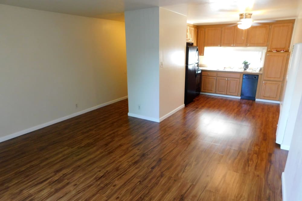 Spacious kitchen and living room area in Concord, CA at the Whispering Oaks.