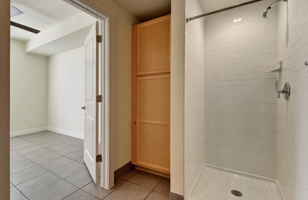 Bedroom with attached bathroom at Homestead Oaks Apartments in Austin,Texas