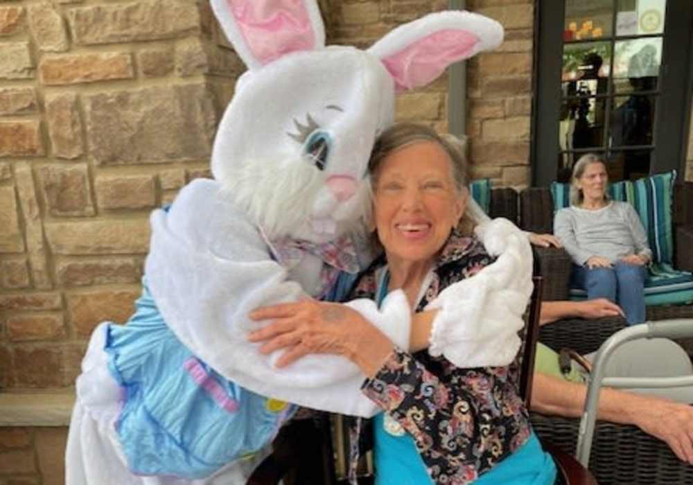 Resident hugging the Easter Bunny at Truewood by Merrill, Keller in Keller, Texas