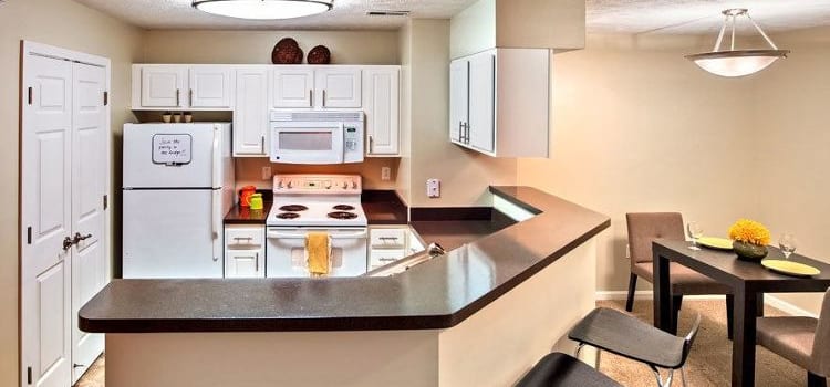Modern kitchen and dining area at Waterford Nevillewood Apartments