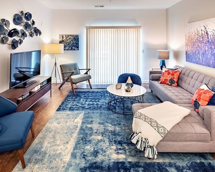 Well decorated living room at The Kane at Gray's Landing in Aliquippa, PA