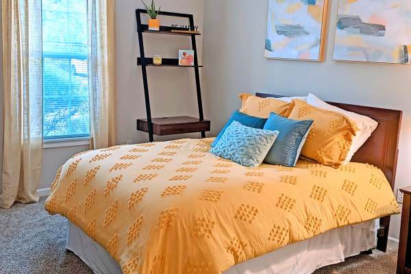 Spacious bedroom with wall paintings at Ventana Hills in Coraopolis, Pennsylvania