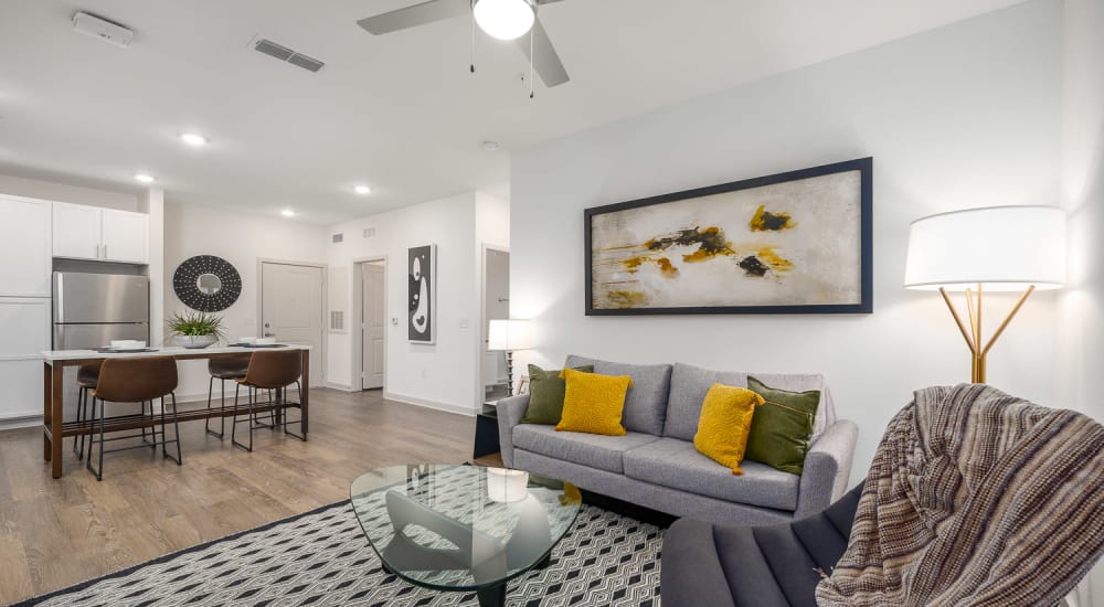 An apartment living room, dining room and kitchen at Novo Westlake in Jacksonville, Florida