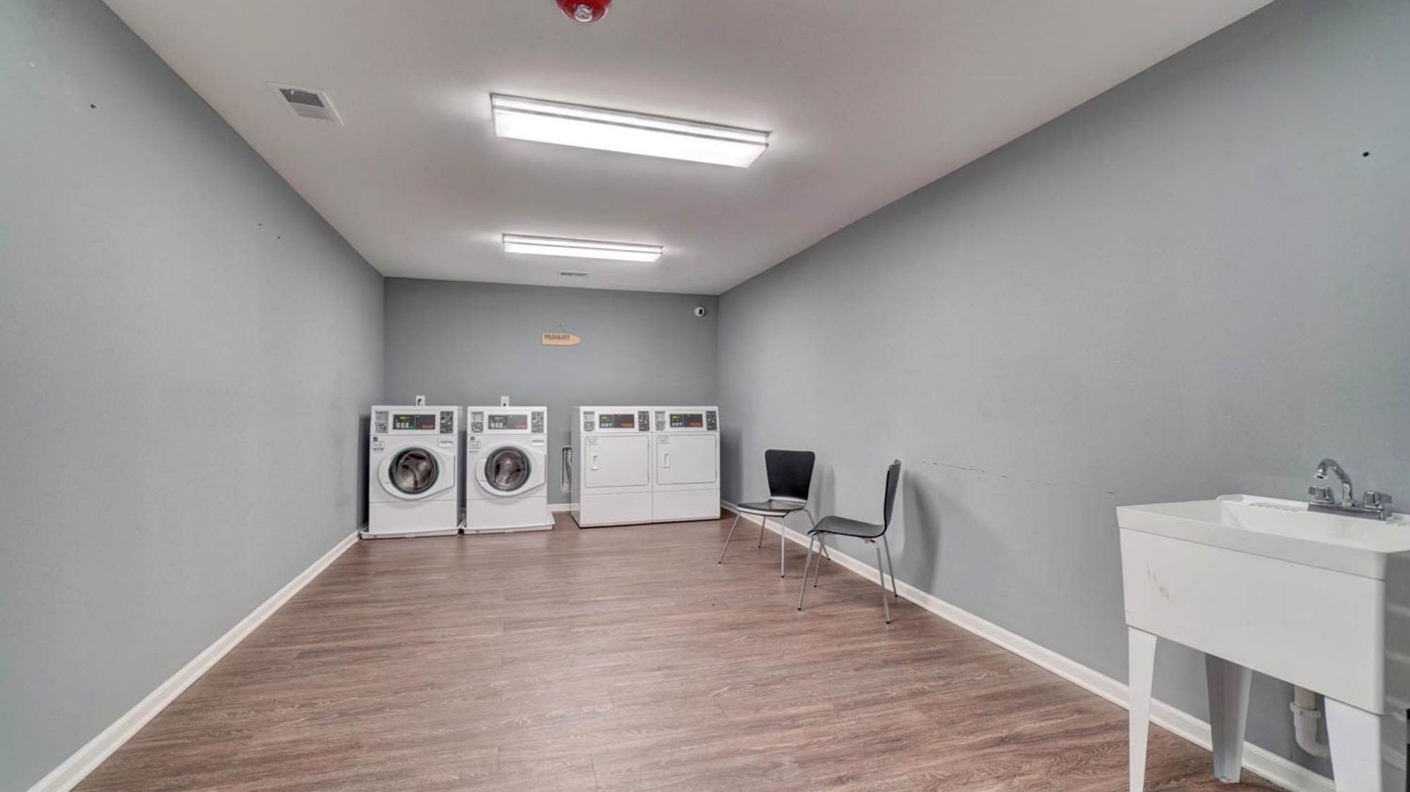 Laundry with wood flooring at Holley Pointe in Portsmouth. VA