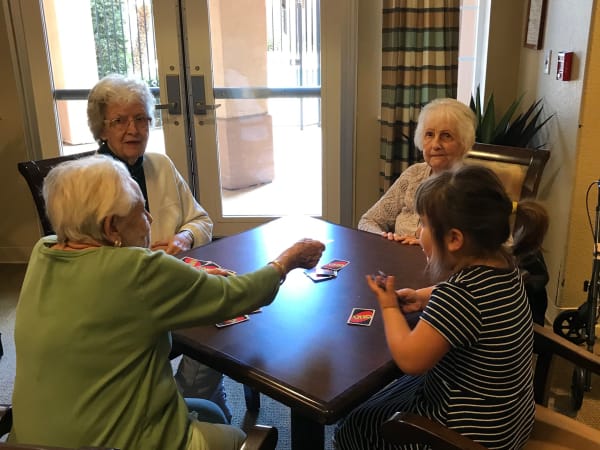 Residents and family playing a game at The Lakes at Banning in Banning, California. 