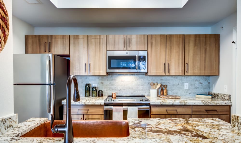 Attractive kitchen with a skylight at Riata Austin in Austin, Texas
