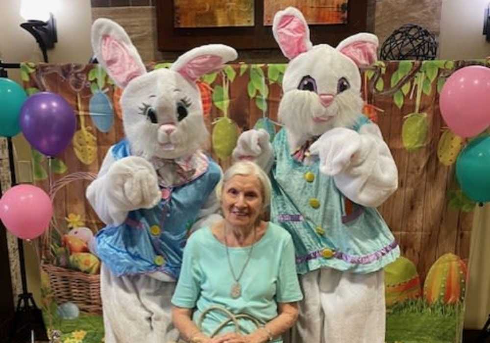 Resident with two Easter Bunnies at Truewood by Merrill, Keller in Keller, Texas