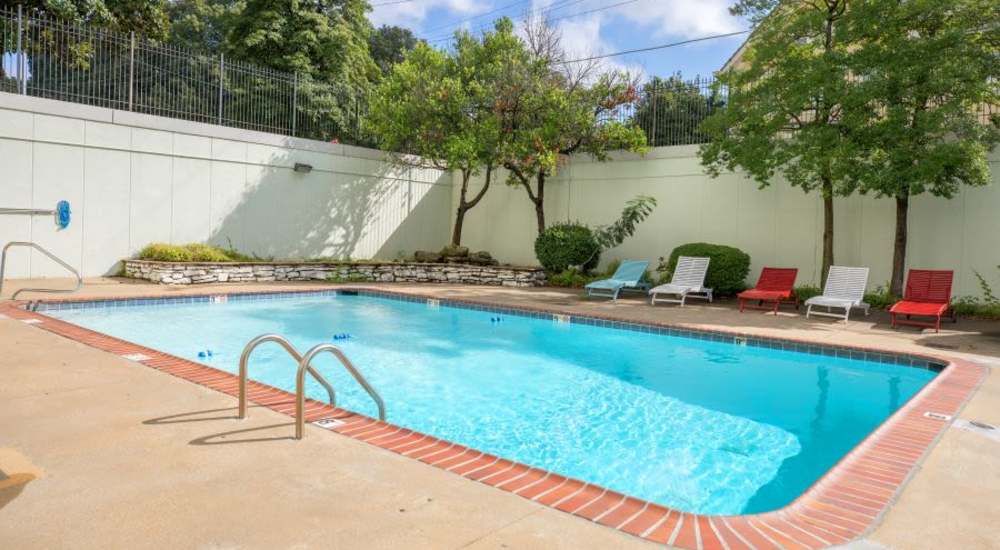 A serene swimming pool with lounge chairs at Central Gardens in Memphis, Tennessee