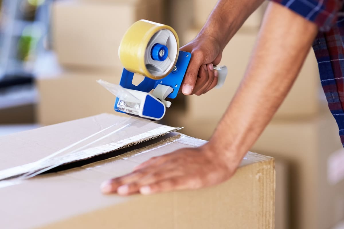 A man packing a box at Carolina Secure Storage in Henderson, North Carolina