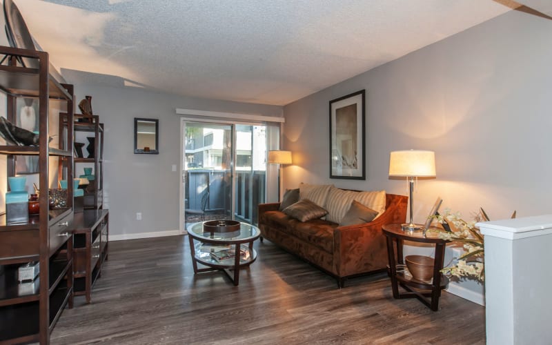 Spacious living room with a private patio at Avery Park Apartments in Fairfield, California
