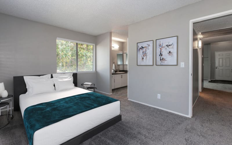 Bedroom with plush carpeting at Bennington Apartments in Fairfield, California