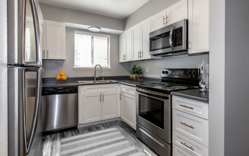 Renovated kitchen with stainless-steel appliances at Bennington Apartments in Fairfield, California