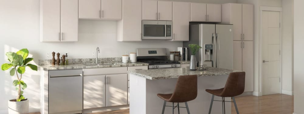 An apartment kitchen with stainless appliances at The Hardison in Salt Lake City, Utah