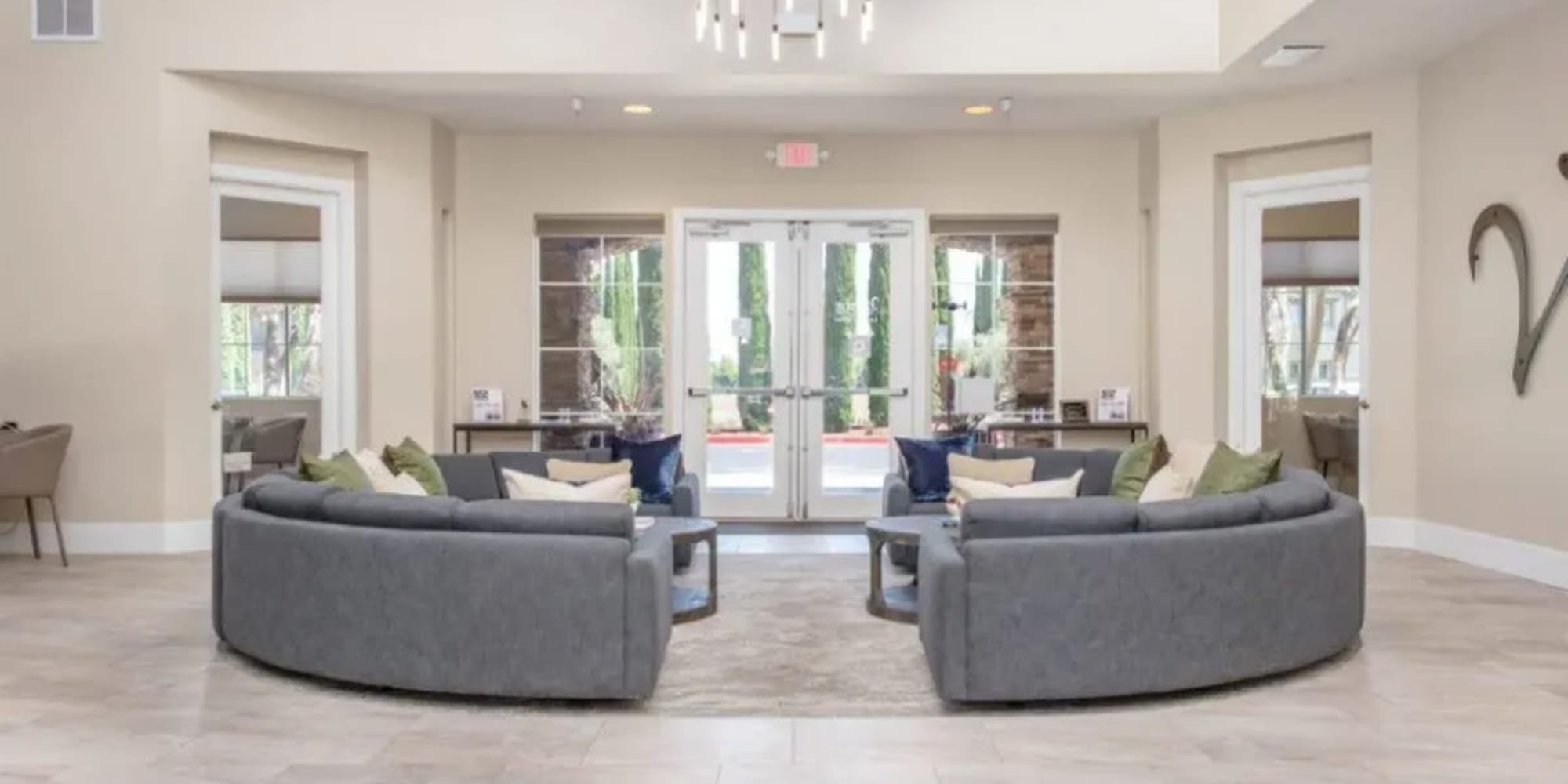Couches in the elegant resident clubhouse at Villagio Luxury Apartments in Sacramento, California