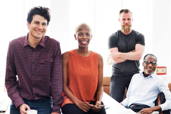 People sitting on a desk for Office Space Everett