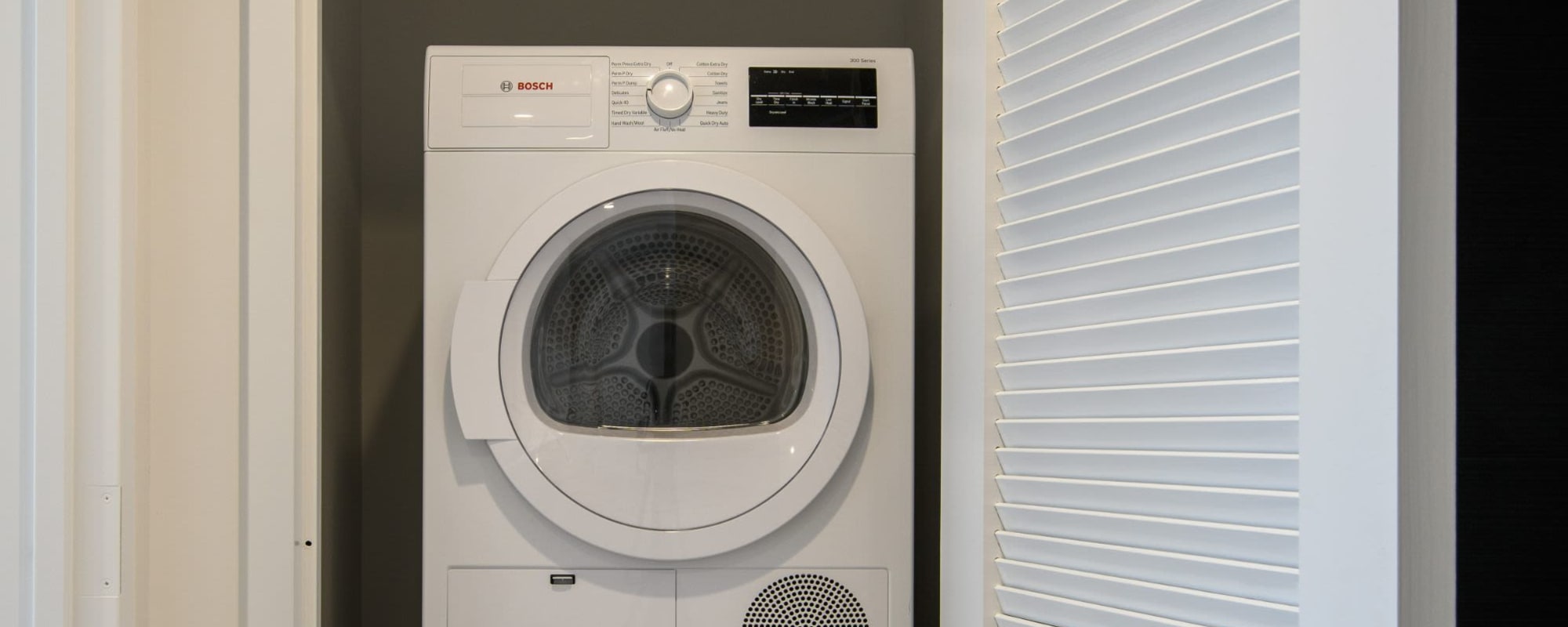 Rendering laundry room on apartment model at 8 Court Square in Long Island City, New York