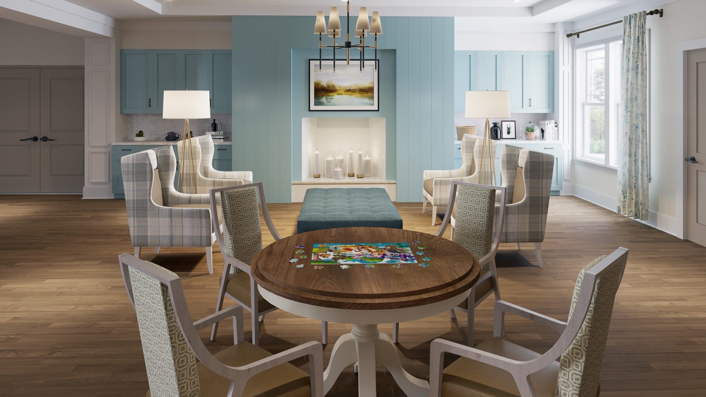 Close-up view of a dining table set with four chairs and circular table at Monark Grove Madison in Madison, Alabama