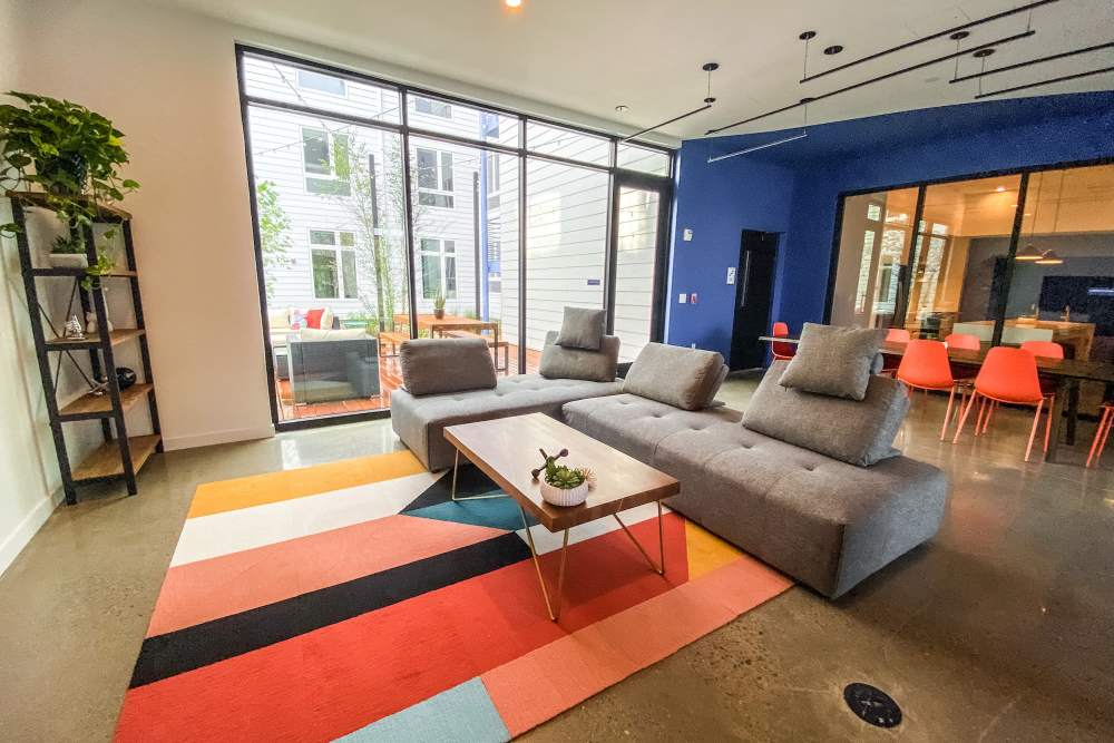 Lounge area with couch, chairs, coffee table at Martin Flats in Nashville, Tennessee