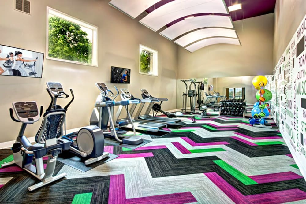 Fitness center with plenty of individual workout stations at Wellington Apartment Homes in Silverdale, Washington