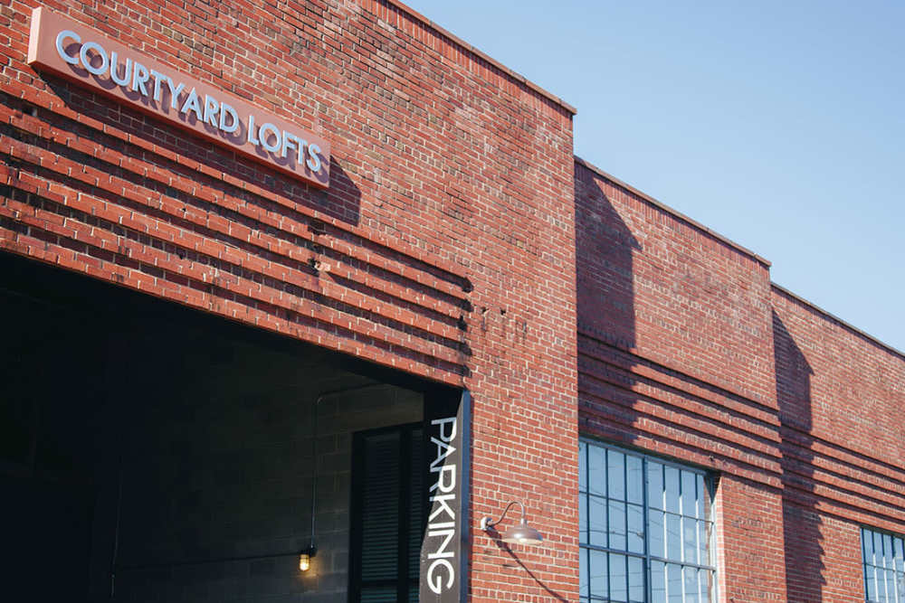 Loft-style apartments with parking access at Courtyard Lofts at Scott’s Addition in Richmond, Virginia