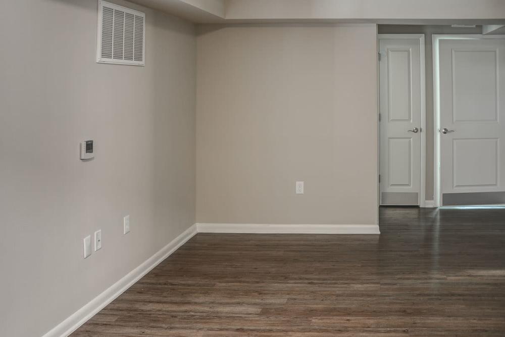 Model apartment living area with air conditioning at Bell Diamond Manor in Norfolk, Virginia