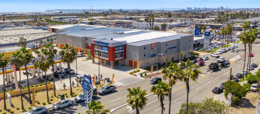 Large palm trees surround the facility in National City, California at A-1 Self Storage