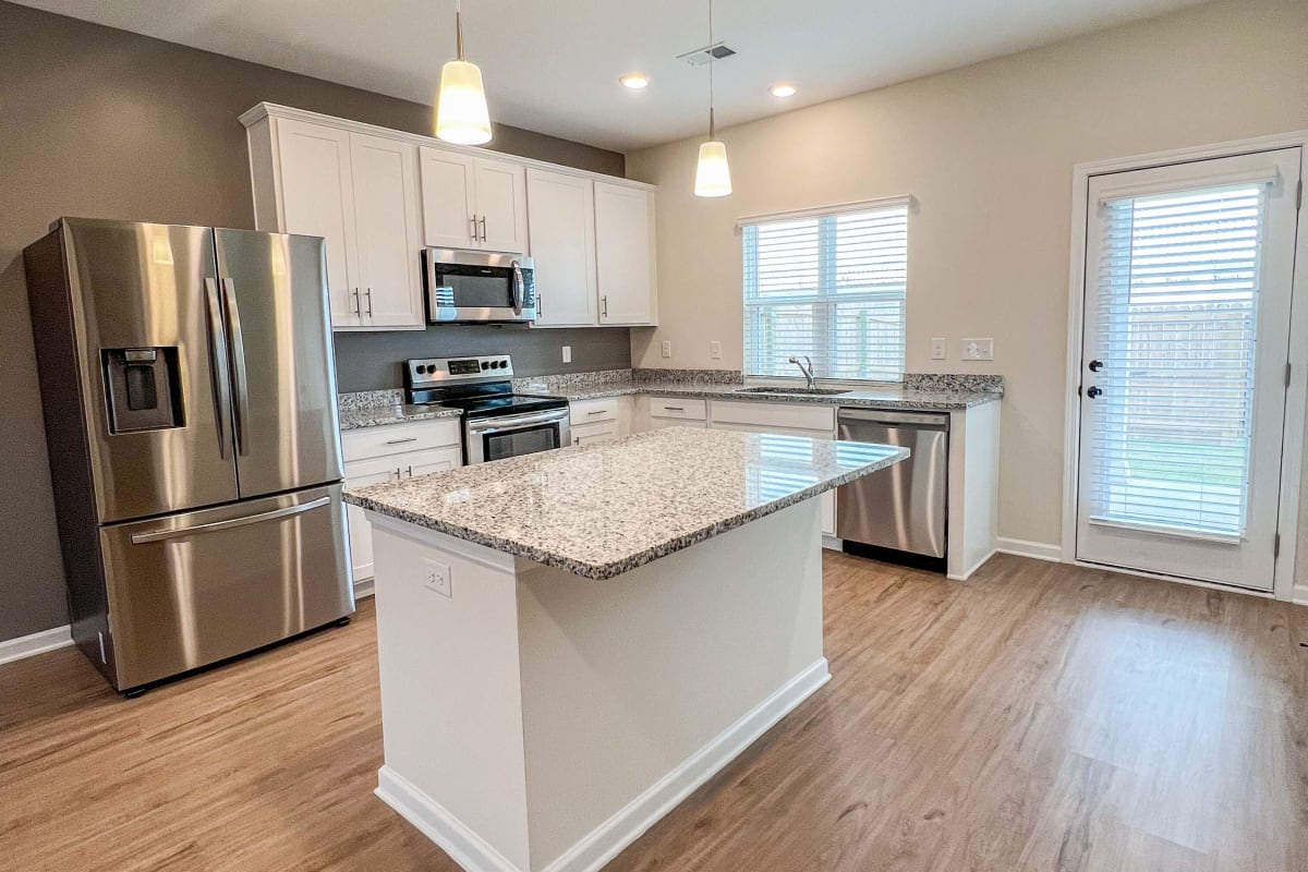 Modern kitchen with island at Parallel 36 at Legacy in Opelika, Alabama